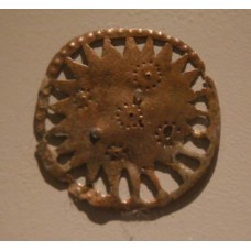 Bronze solar disc with circle dot forming a cross
